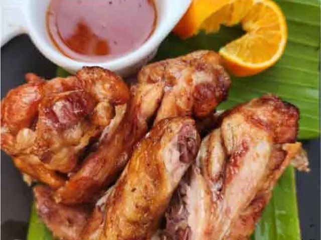 Fried chicken wings in seasoned flour.