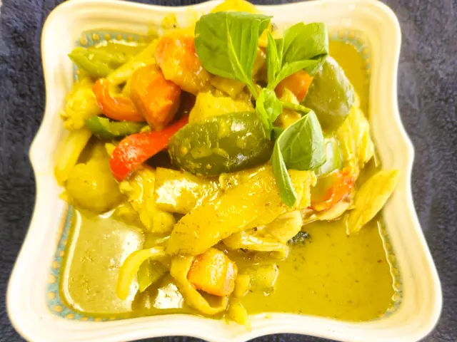 Green curry with Thai eggplant and basil in a coconut broth.