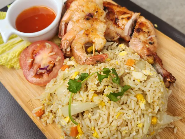 A plate of Sab fried rice with shrimp and chicken.